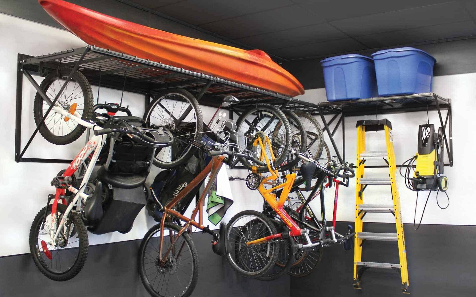 Overhead garage storage racks installed above vehicles